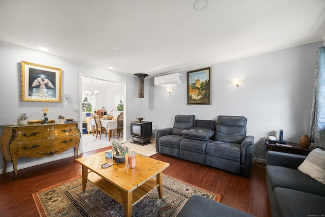 8 Cornfield Rd, Waterbury, CT 06704 - living area with a wall mounted air conditioner, wood finished floors, recessed lighting, and a chandelier