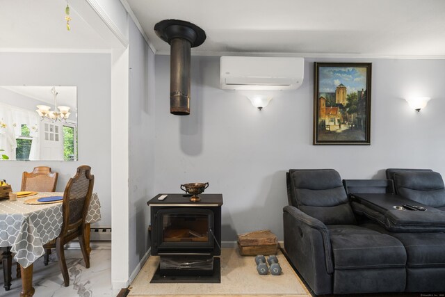 8 Cornfield Rd, Waterbury, CT 06704 - living area with a wall unit AC, a wood stove, a chandelier, and baseboard heating