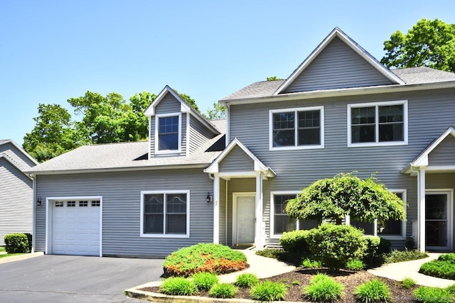 375 Allyn St Unit A4, Groton, CT 06355 - view of front facade with an attached garage, asphalt driveway, and a shingled roof