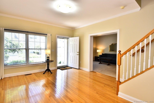 375 Allyn St Unit A4, Groton, CT 06355 - foyer featuring light wood finished floors, crown molding, and stairs