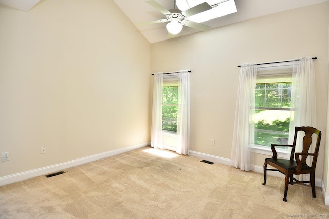 375 Allyn St Unit A4, Groton, CT 06355 - empty room with ceiling fan, light carpet, high vaulted ceiling, and a skylight