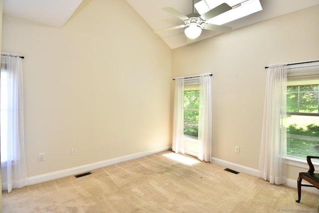 375 Allyn St Unit A4, Groton, CT 06355 - empty room with light carpet, plenty of natural light, ceiling fan, high vaulted ceiling, and a skylight