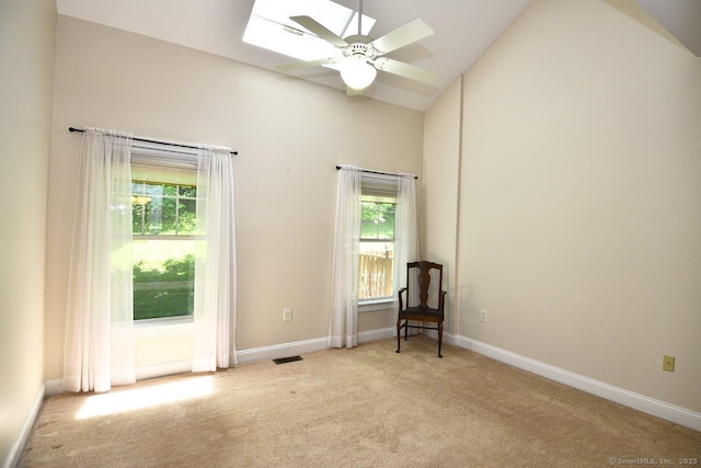 375 Allyn St Unit A4, Groton, CT 06355 - unfurnished room with light colored carpet, a ceiling fan, a skylight, plenty of natural light, and high vaulted ceiling