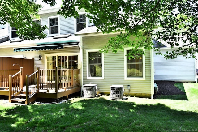 375 Allyn St Unit A4, Groton, CT 06355 - rear view of house with a wooden deck and a lawn
