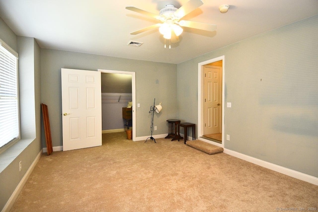 375 Allyn St Unit A4, Groton, CT 06355 - unfurnished bedroom featuring light carpet, multiple windows, a closet, and ceiling fan