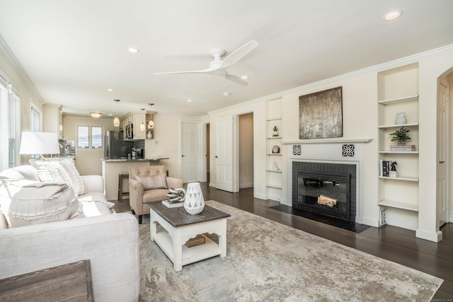 21 Walnut St, Newington, CT 06111 - living area with a fireplace with flush hearth, dark wood-type flooring, built in features, ceiling fan, and recessed lighting
