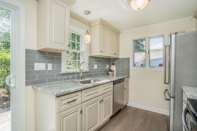 21 Walnut St, Newington, CT 06111 - kitchen featuring appliances with stainless steel finishes, dark wood-style flooring, decorative backsplash, light stone counters, and cream cabinetry
