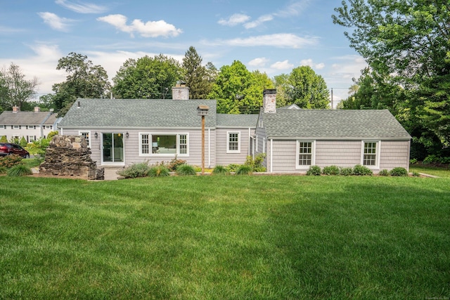 21 Walnut St, Newington, CT 06111 - rear view of property with a yard, roof with shingles, and a chimney