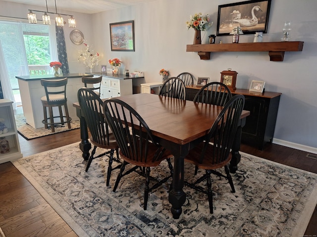 67 Fox Hollow Dr Unit 67, Windsor Locks, CT 06096 - dining space with dark wood finished floors and a chandelier