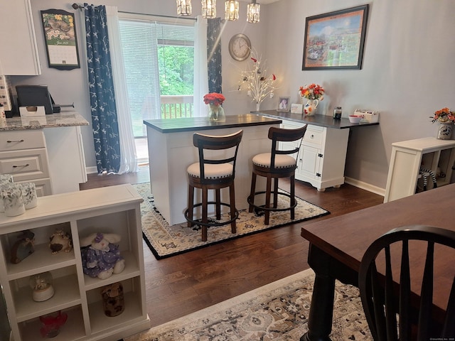 67 Fox Hollow Dr Unit 67, Windsor Locks, CT 06096 - dining space featuring dark wood-type flooring and a chandelier