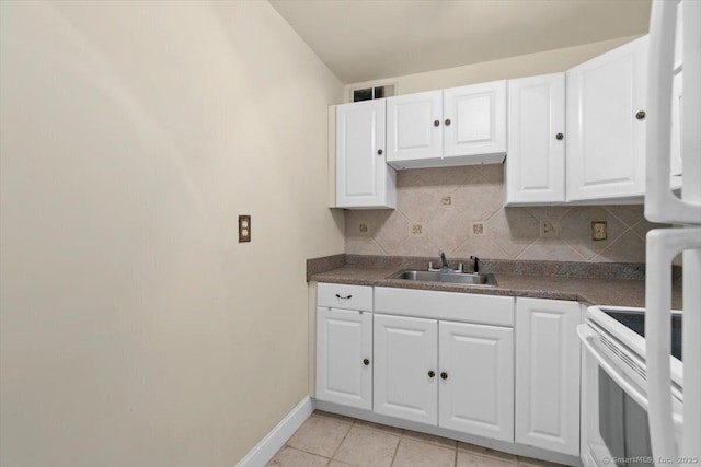100 York St Unit 11B, New Haven, CT 06511 - kitchen with decorative backsplash, white cabinets, and dark countertops