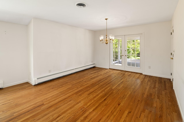173 Russet Rd, Stamford, CT 06903 - spare room with a baseboard radiator, light wood-style flooring, and a chandelier
