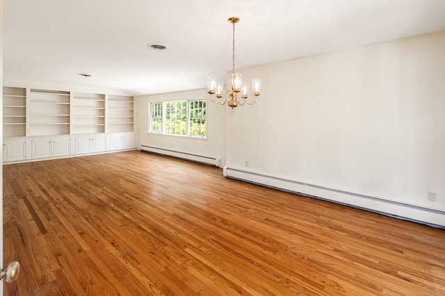 173 Russet Rd, Stamford, CT 06903 - spare room featuring baseboard heating, light wood-type flooring, a chandelier, and built in features