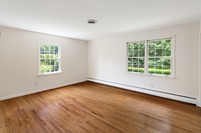 173 Russet Rd, Stamford, CT 06903 - spare room with a baseboard radiator and wood finished floors
