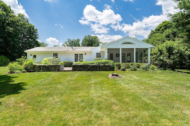 173 Russet Rd, Stamford, CT 06903 - rear view of house with a yard and a fire pit