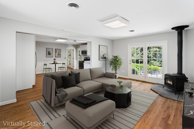 173 Russet Rd, Stamford, CT 06903 - living area with a wood stove and wood finished floors