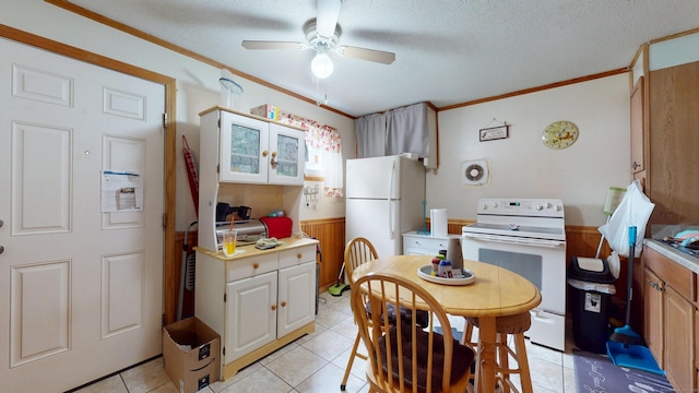35 Cianci Rd, New Britain, CT 06053 - kitchen featuring white appliances, a ceiling fan, ornamental molding, light countertops, and light tile patterned floors
