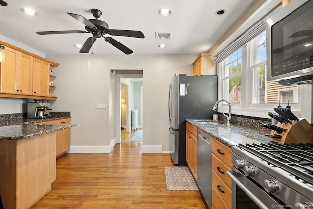 140 Griswold Dr, West Hartford, CT 06119 - kitchen featuring appliances with stainless steel finishes, light wood-style floors, light brown cabinetry, recessed lighting, and dark stone countertops