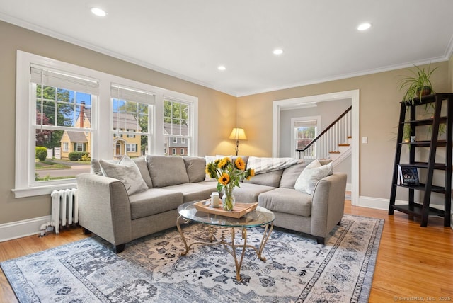 140 Griswold Dr, West Hartford, CT 06119 - living area with radiator heating unit, ornamental molding, light wood-style flooring, stairway, and recessed lighting