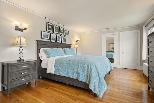 140 Griswold Dr, West Hartford, CT 06119 - bedroom featuring light wood-style flooring and crown molding