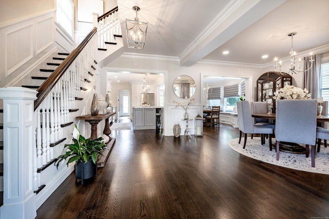 13 Myrtle St, Norwalk, CT 06855 - dining room featuring a decorative wall, a chandelier, stairway, dark wood-style flooring, and ornamental molding