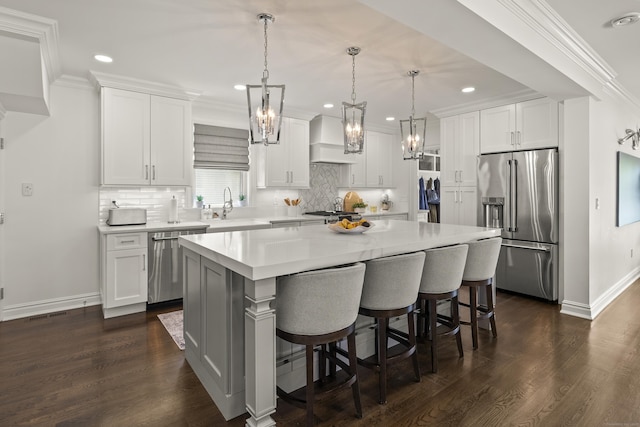 13 Myrtle St, Norwalk, CT 06855 - kitchen featuring stainless steel appliances, premium range hood, light countertops, a kitchen island, and tasteful backsplash