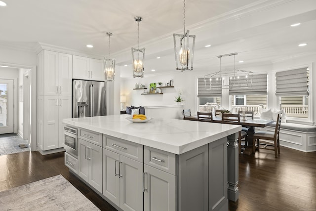 13 Myrtle St, Norwalk, CT 06855 - kitchen with high end refrigerator, recessed lighting, ornamental molding, gray cabinetry, and dark wood-type flooring