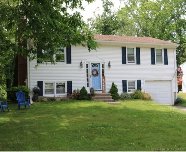 155 Fawn Hill Dr, Westbrook, CT 06498 - split foyer home with an attached garage, a front yard, and driveway
