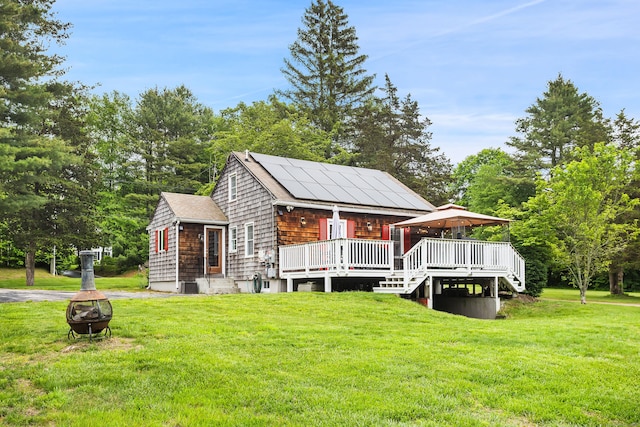 57 Falls Bashan Rd, East Haddam, CT 06469 - view of front of home with an outdoor fire pit, a gazebo, a front yard, a wooden deck, and a shingled roof