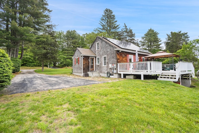 57 Falls Bashan Rd, East Haddam, CT 06469 - view of side of property with a wooden deck and a lawn