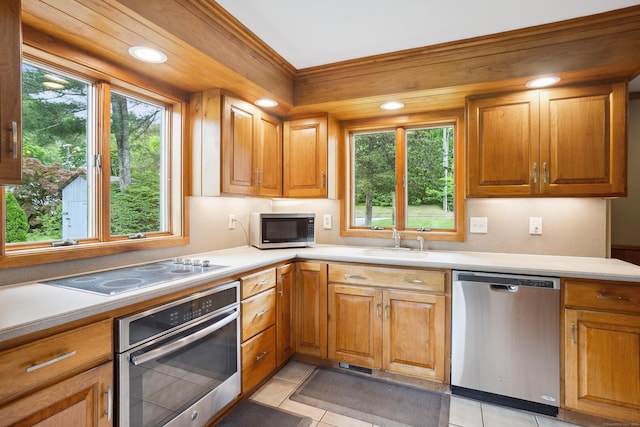 57 Falls Bashan Rd, East Haddam, CT 06469 - kitchen with appliances with stainless steel finishes, healthy amount of natural light, light tile patterned flooring, and light countertops