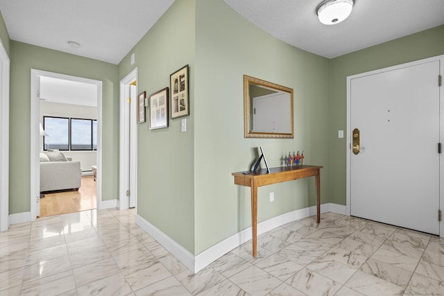 3200 Park Ave Unit 9B1, Bridgeport, CT 06604 - foyer featuring light marble finish floors and baseboards