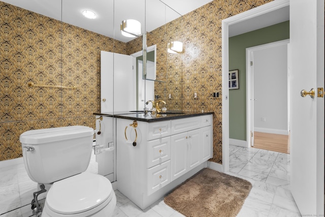 3200 Park Ave Unit 9B1, Bridgeport, CT 06604 - bathroom featuring vanity, marble look tile flooring, and wallpapered walls
