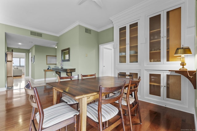 3200 Park Ave Unit 9B1, Bridgeport, CT 06604 - dining space with wood finished floors, ornamental molding, and ceiling fan