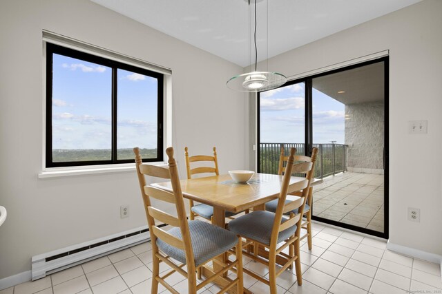 3200 Park Ave Unit 9B1, Bridgeport, CT 06604 - dining area with a baseboard heating unit and light tile patterned floors