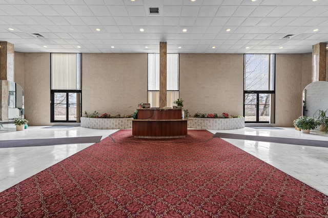 3200 Park Ave Unit 9B1, Bridgeport, CT 06604 - common area with expansive windows, a high ceiling, and recessed lighting