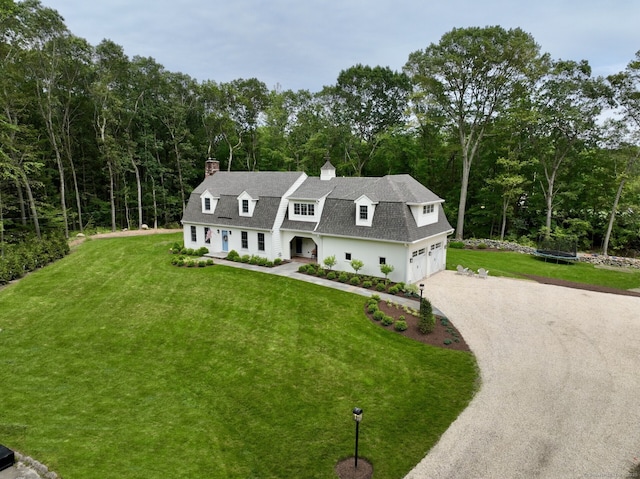 32 Isinglass Ter, Trumbull, CT 06611 - colonial inspired home with driveway, a shingled roof, a front lawn, and a chimney
