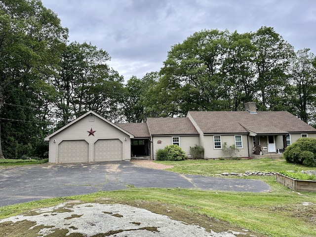 123 Silkey Rd, Granby, CT 06060 - ranch-style house with an attached garage, driveway, a front lawn, and a chimney