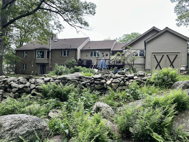 123 Silkey Rd, Granby, CT 06060 - rear view of house with a wooden deck and brick siding