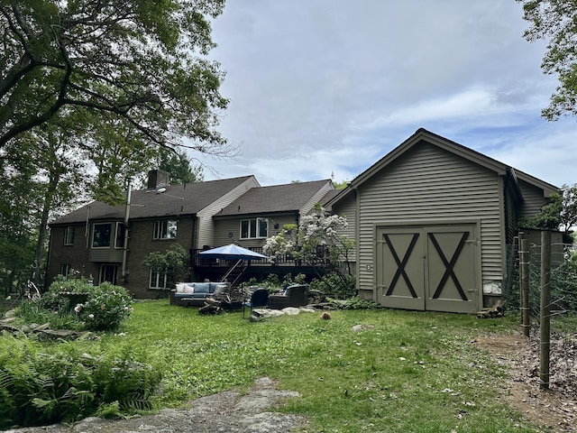 123 Silkey Rd, Granby, CT 06060 - back of property with outdoor lounge area, a lawn, a storage shed, and a chimney