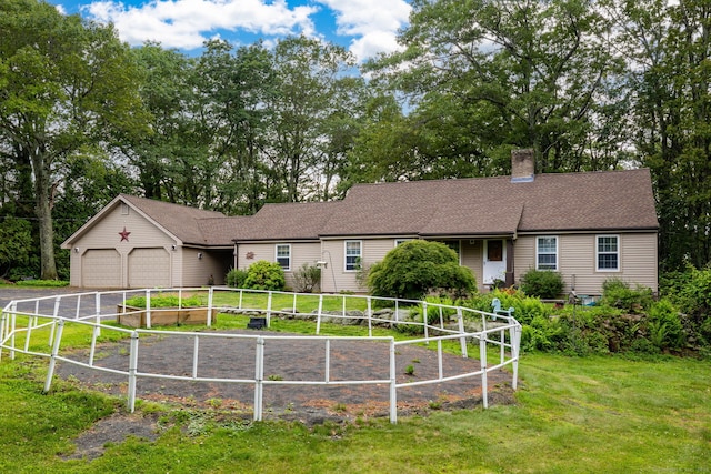 123 Silkey Rd, Granby, CT 06060 - single story home featuring an attached garage, a chimney, driveway, and view of wooded area