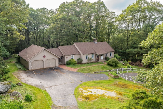 123 Silkey Rd, Granby, CT 06060 - single story home with a garage, asphalt driveway, and a chimney