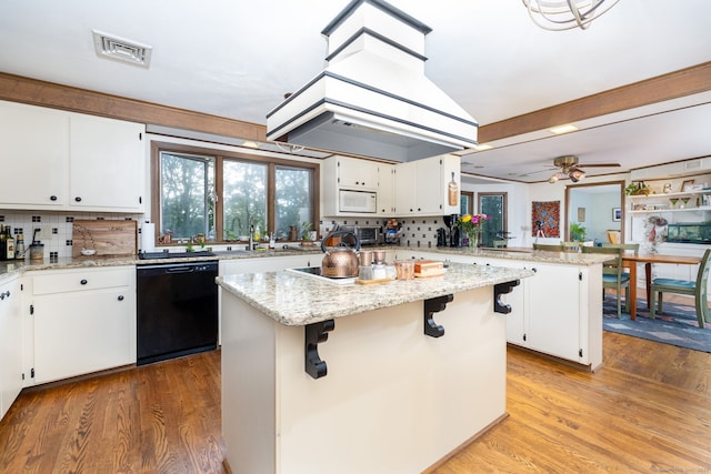 123 Silkey Rd, Granby, CT 06060 - kitchen featuring dishwasher, a peninsula, a kitchen island, tasteful backsplash, and white cabinetry