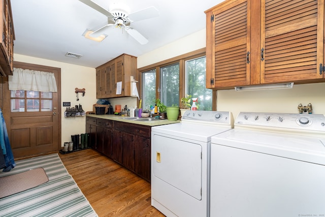 123 Silkey Rd, Granby, CT 06060 - washroom featuring cabinet space, washer and dryer, a ceiling fan, and light wood-style flooring
