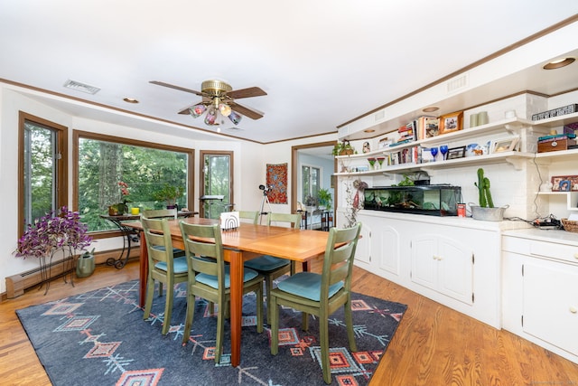 123 Silkey Rd, Granby, CT 06060 - dining room with ceiling fan, light wood-style flooring, baseboard heating, and crown molding