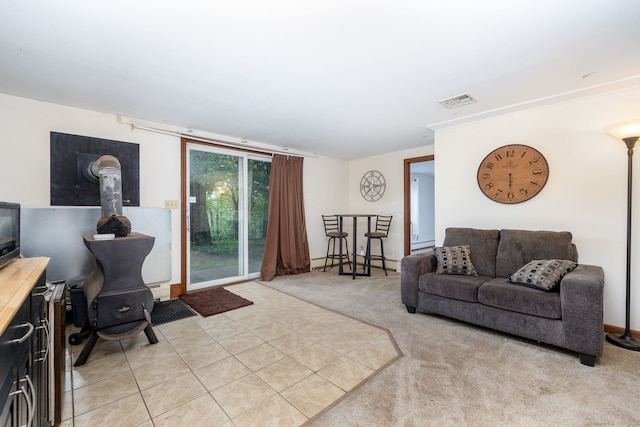 123 Silkey Rd, Granby, CT 06060 - living room featuring a wood stove, light carpet, light tile patterned floors, and a baseboard heating unit