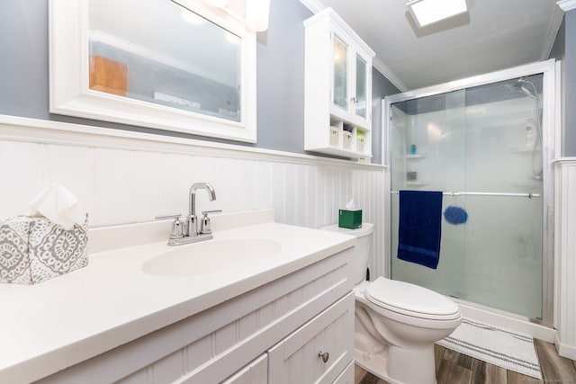 123 Silkey Rd, Granby, CT 06060 - full bath with a shower stall, vanity, wood finished floors, a wainscoted wall, and a decorative wall