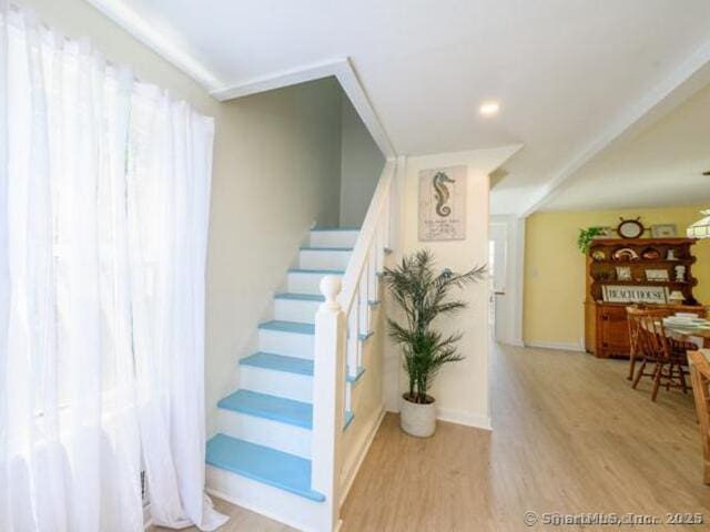 102 Surf Ave, Milford, CT 06460 - staircase featuring wood finished floors and baseboards