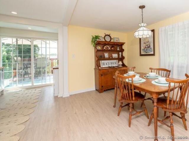 102 Surf Ave, Milford, CT 06460 - dining space featuring light wood-style flooring and baseboards