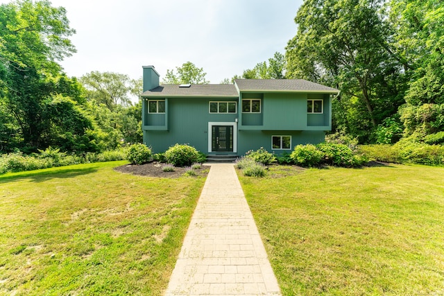 24 Newton St, Norwich, CT 06360 - view of front facade with a chimney and a front lawn